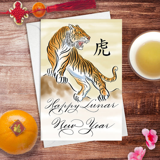 Lifestyle desk image of the calligraphy greeting card: Happy Lunar New Year of the Tiger in watercolour design