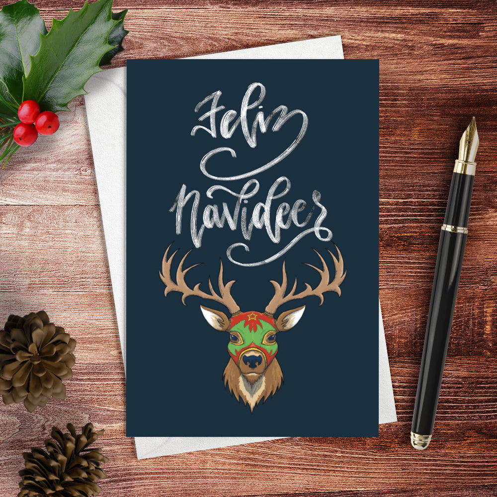 A lifestyle view of the greeting card: "Feliz Navideer"