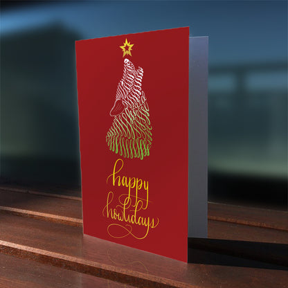 A lifestyle view of the greeting card: "Happy Howlidays"