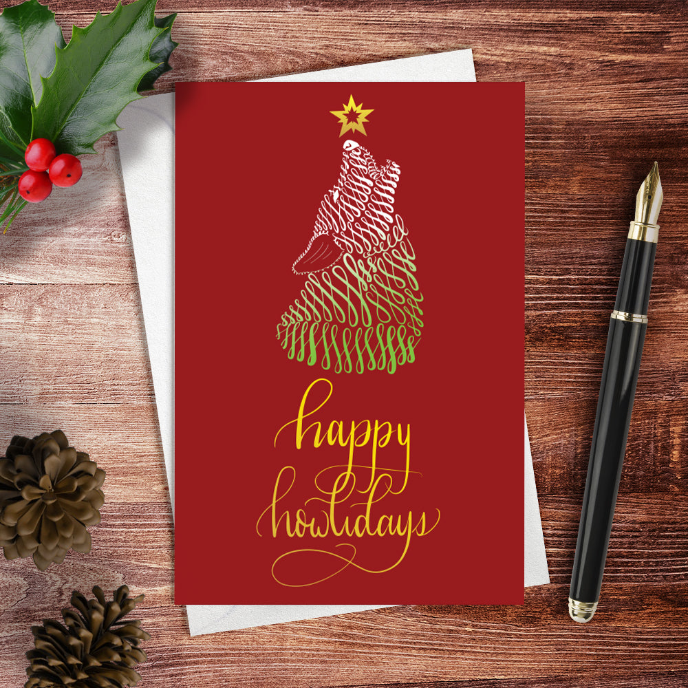 A lifestyle view of the greeting card: "Happy Howlidays"