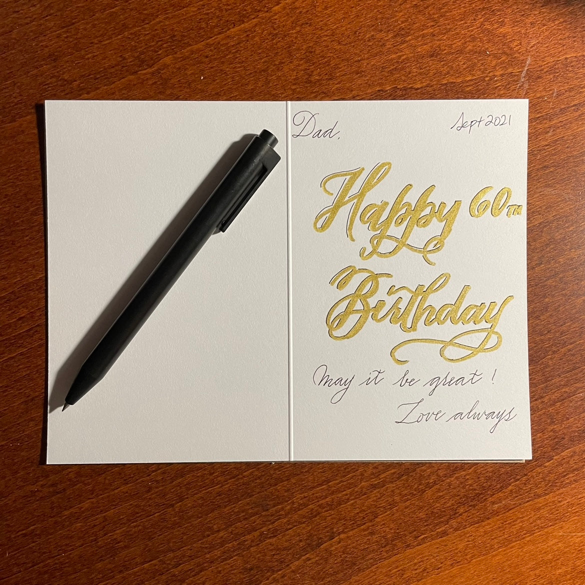 Ask for a handwritten calligraphy message on your behalf and mailed by Nibs and Scripts! | Text: "Dad, Happy 60th Birthday! May it be great! Love always"