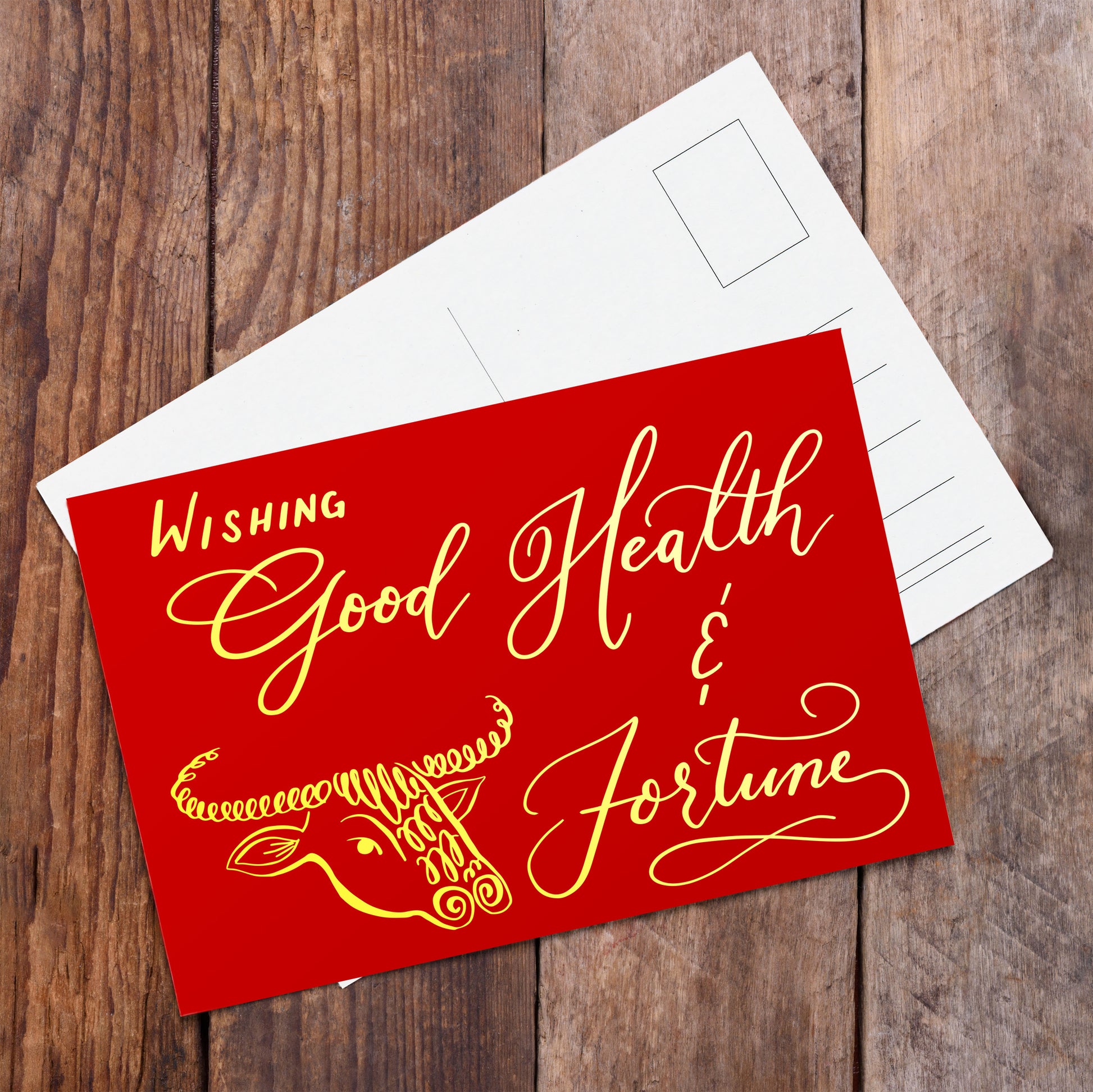 A lifestyle view of the postcard: "Wishing Good Health & Fortune"