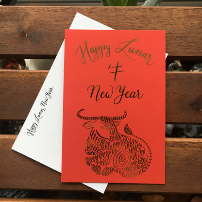 A lifestyle view of the postcard: "Happy Lunar New Year"