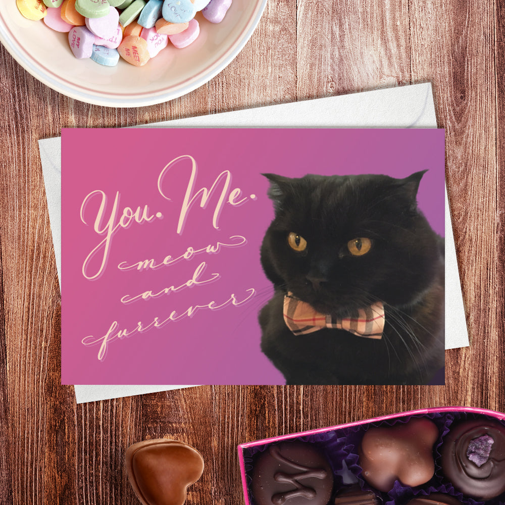 A lifestyle view of the greeting card: "You. Me. Meow and Furrever"
