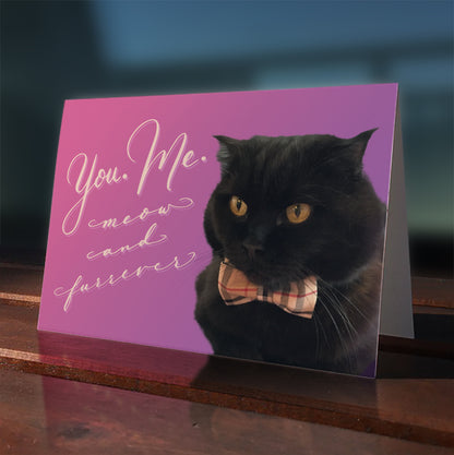 A lifestyle view of the greeting card: "You. Me. Meow and Furrever"
