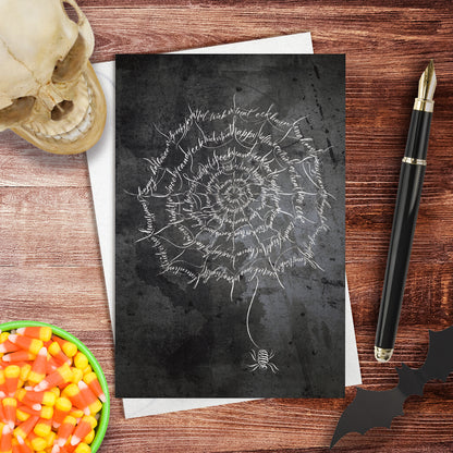 A lifestyle view of the Halloween Calligraphy card "Spider Web" design