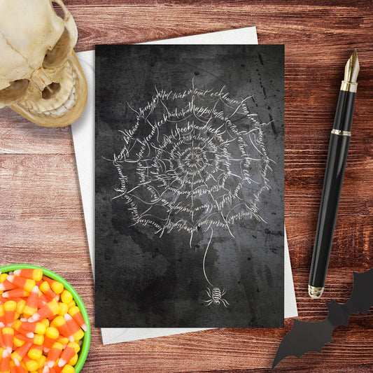 A lifestyle view of the Halloween Calligraphy card "Spider Web" design