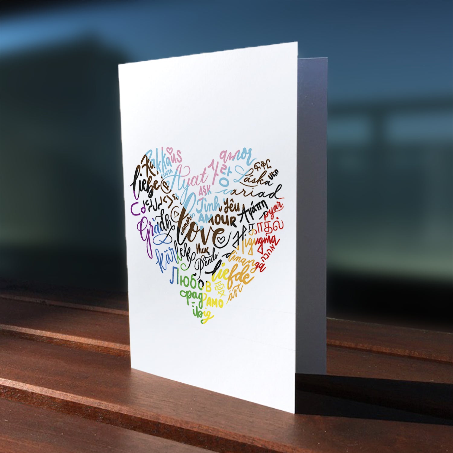 A lifestyle view of the greeting card: "The Language of Love"