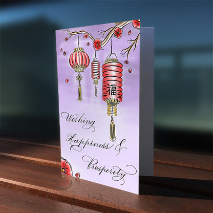 Lifestyle outdoor image: Wishing Happiness  and Prosperity Lunar New Year Greeting Card, designed in calligraphy with red lanterns and blossoms on a purple landscape