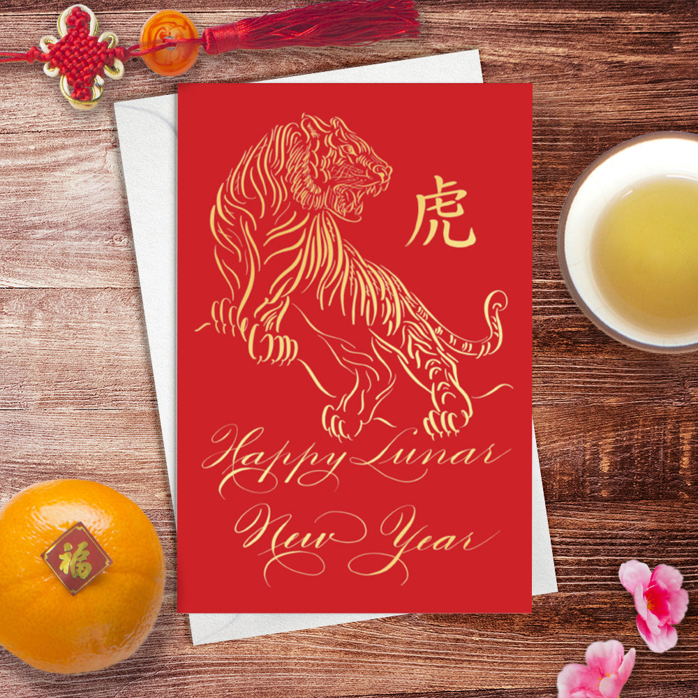 Lifestyle desk image of the calligraphy greeting card: Happy Lunar New Year of the Tiger in Gold foil design