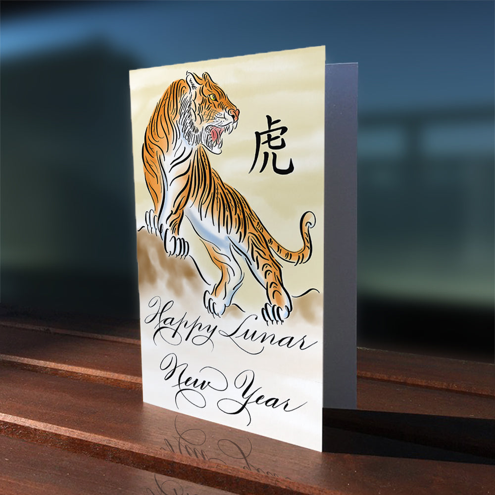 Lifestyle outdoor image of the calligraphy greeting card: Happy Lunar New Year of the Tiger in watercolour design