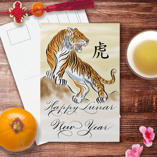 Lifestyle desk image of the calligraphy postcard: Happy Lunar New Year of the Tiger in watercolour design