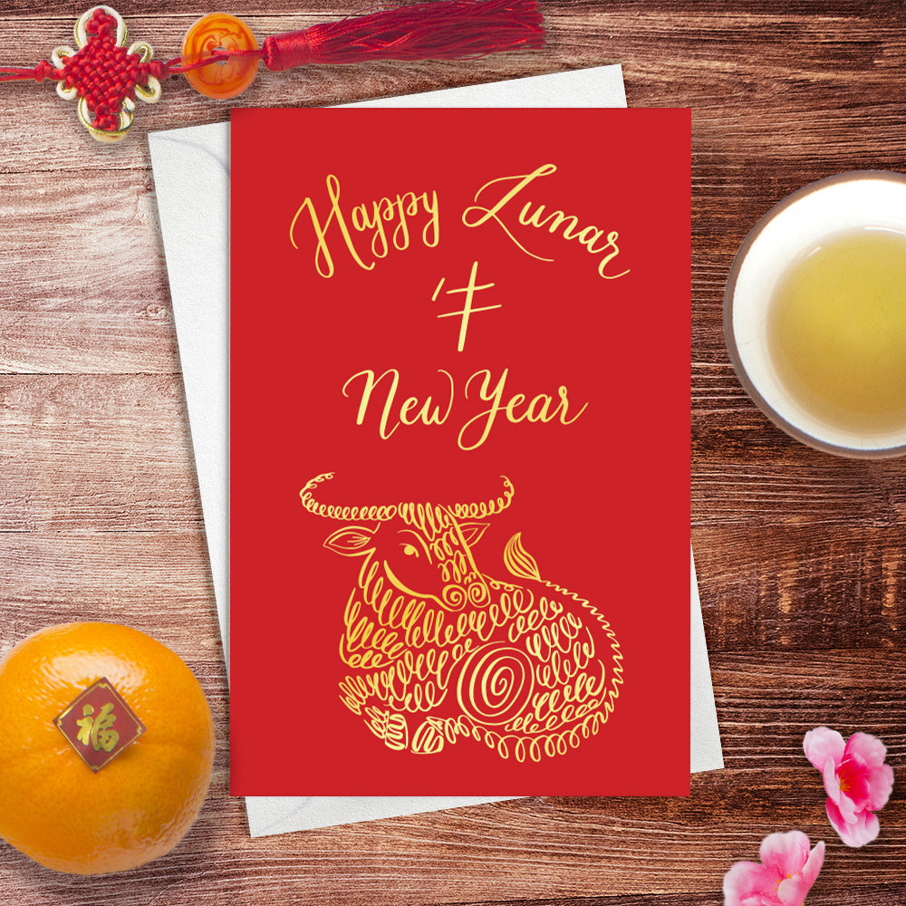A lifestyle view of the greeting card: "Happy Lunar New Year"