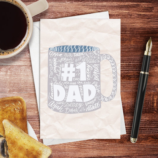 A lifestyle view of the Toronto Calligraphy drawn greeting card: "No. 1 Dad" with many languages to say dad