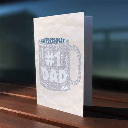 A lifestyle view of the Toronto Calligraphy drawn greeting card: "No. 1 Dad" with many languages to say dad